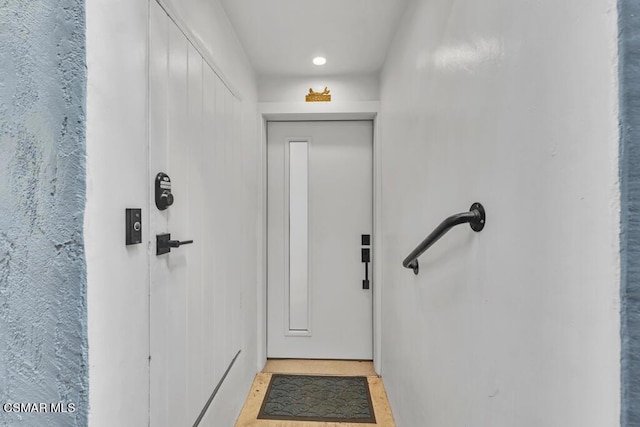 entryway with light tile patterned flooring