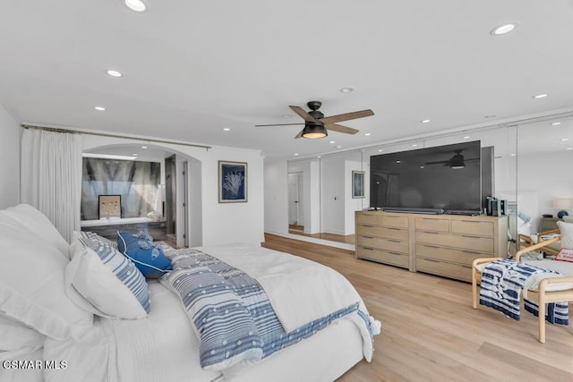 bedroom featuring ceiling fan and light hardwood / wood-style floors