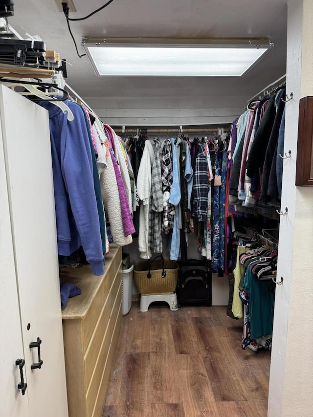 walk in closet featuring dark hardwood / wood-style flooring