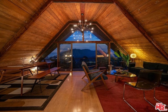 interior space featuring wooden ceiling, a chandelier, a mountain view, and vaulted ceiling with beams