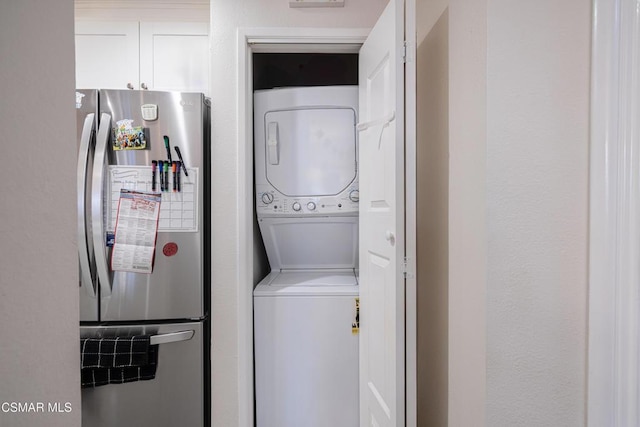 laundry room featuring stacked washer and dryer