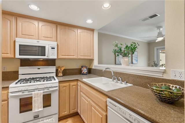 kitchen with white appliances, light brown cabinetry, sink, ornamental molding, and ceiling fan