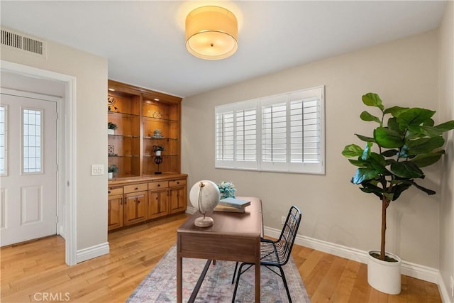 office featuring plenty of natural light and light hardwood / wood-style floors