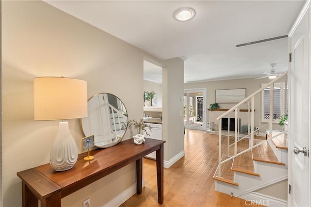 hallway with hardwood / wood-style flooring