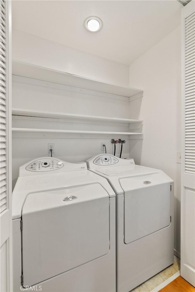 washroom featuring washer and dryer