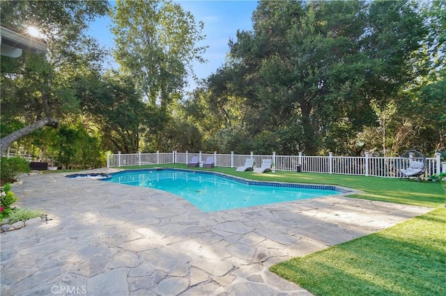 view of pool with a lawn, a patio area, a fenced backyard, and a pool with connected hot tub