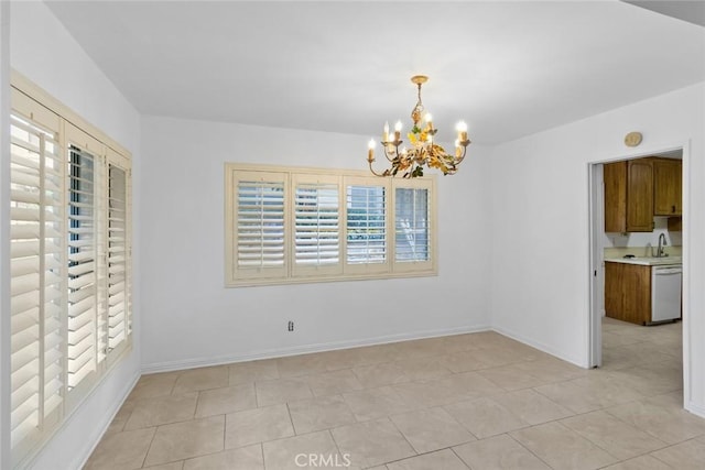 unfurnished dining area with light tile patterned floors, a chandelier, and sink