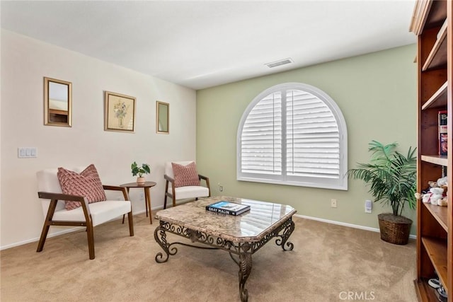 living area with light colored carpet