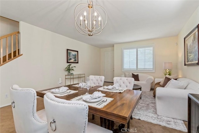 dining space with light carpet and a chandelier