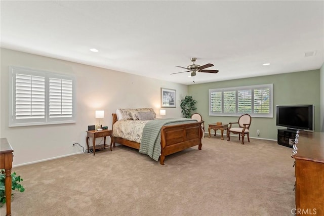 bedroom featuring ceiling fan and light colored carpet