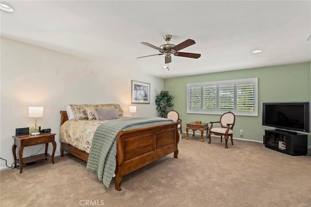 bedroom featuring ceiling fan and light colored carpet