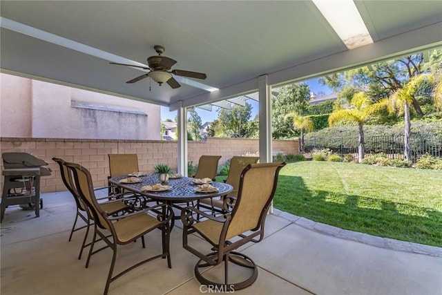 view of patio featuring ceiling fan and a grill