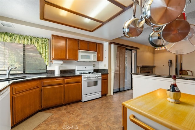 kitchen with sink and white appliances