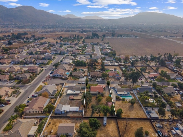 birds eye view of property featuring a mountain view