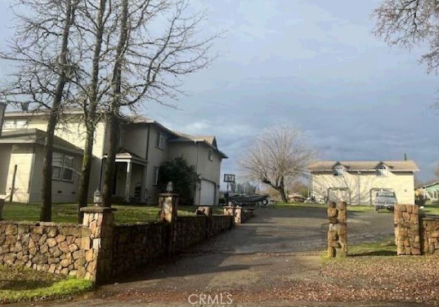 view of home's exterior featuring fence