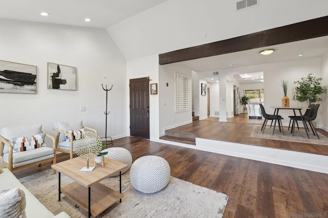 living room featuring wood-type flooring and lofted ceiling