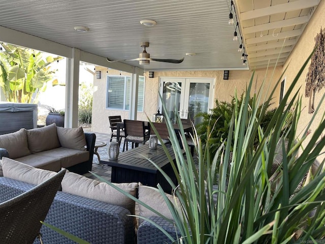 view of patio with ceiling fan and outdoor lounge area