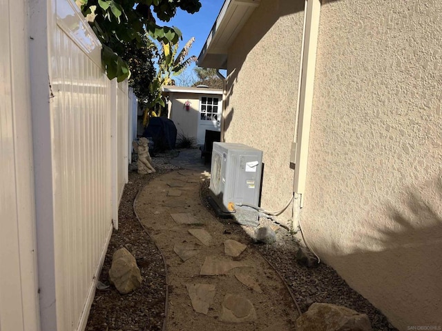 view of home's exterior with ac unit