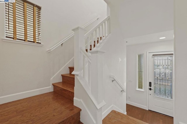 stairs with wood-type flooring