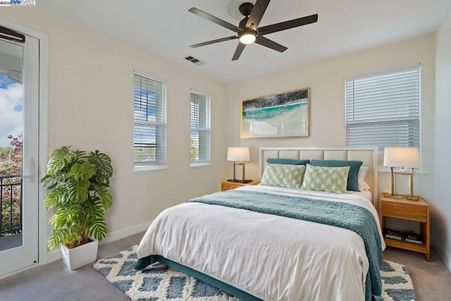 carpeted bedroom featuring access to outside and ceiling fan