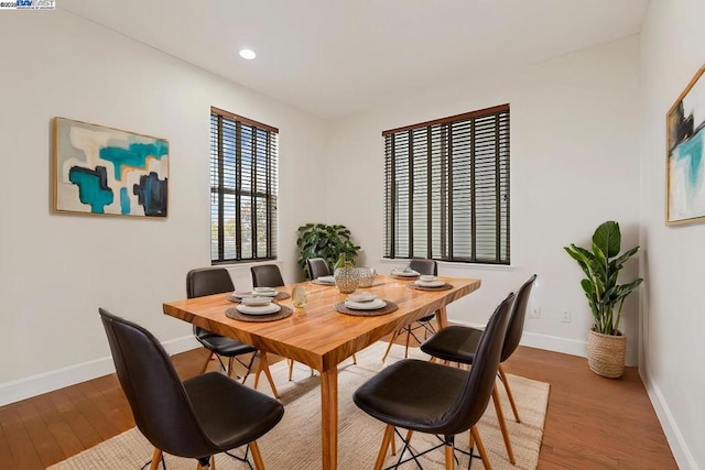 dining space featuring hardwood / wood-style floors