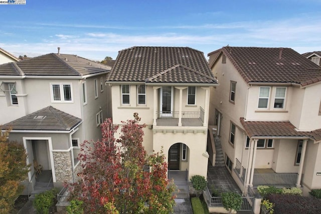 view of front of house with a balcony