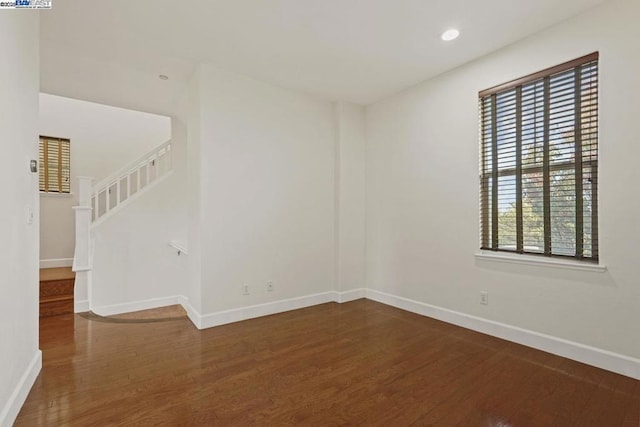 spare room featuring hardwood / wood-style floors