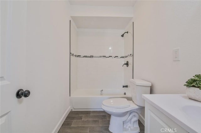 full bathroom with toilet, vanity, and tiled shower / bath combo