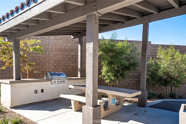 view of patio featuring an outdoor kitchen and area for grilling