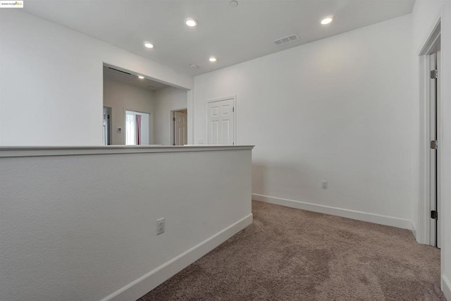 unfurnished room with carpet floors