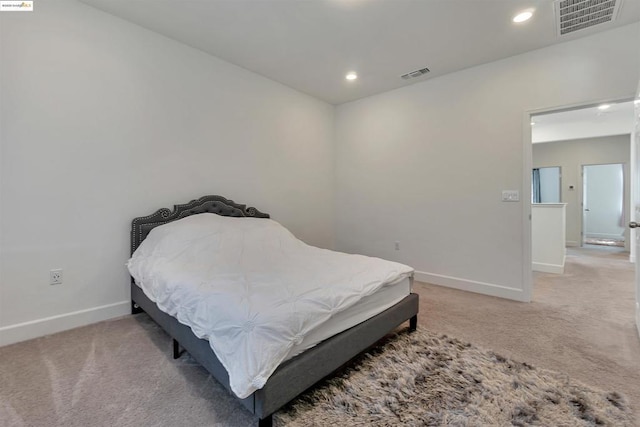 bedroom with light colored carpet