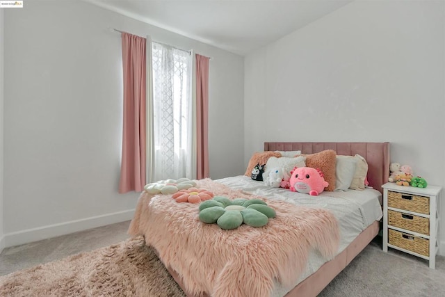 bedroom featuring light colored carpet