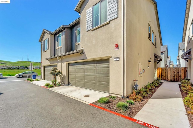 view of property exterior featuring a garage