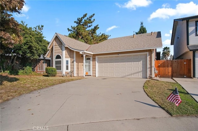 view of front of house featuring a front yard and a garage