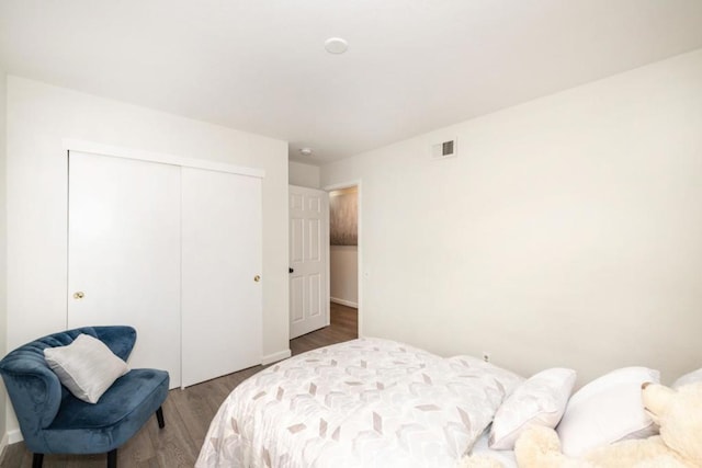 bedroom featuring hardwood / wood-style flooring and a closet