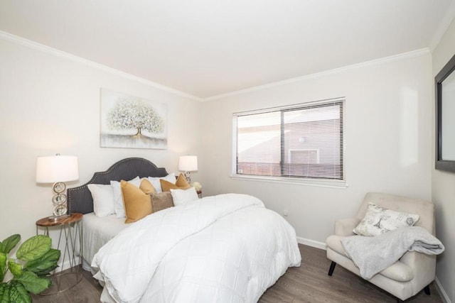 bedroom with crown molding and hardwood / wood-style flooring