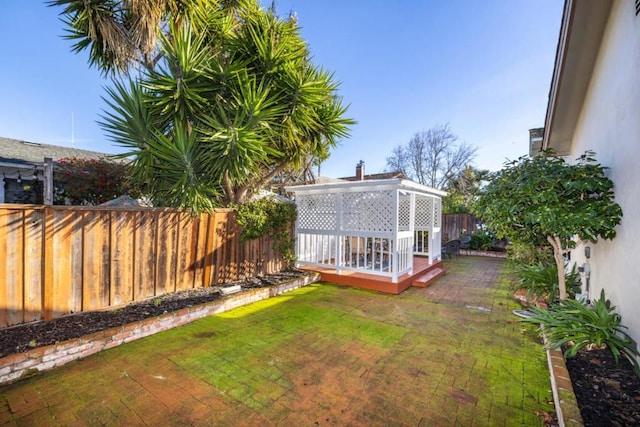 view of yard featuring a wooden deck