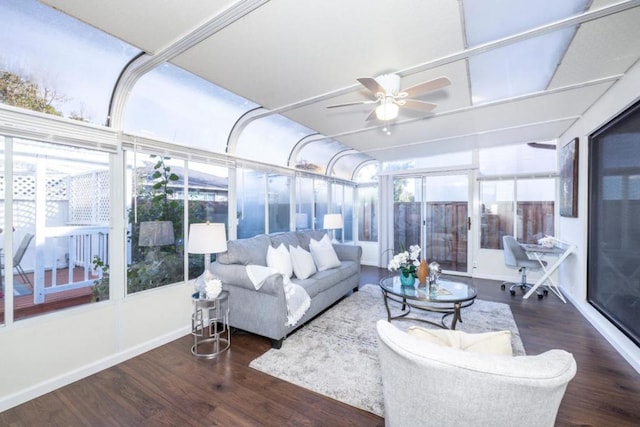 sunroom featuring ceiling fan