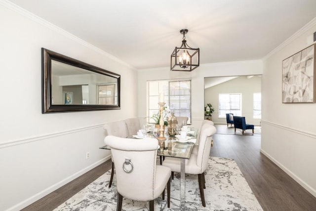 dining space with crown molding, a notable chandelier, and dark hardwood / wood-style flooring