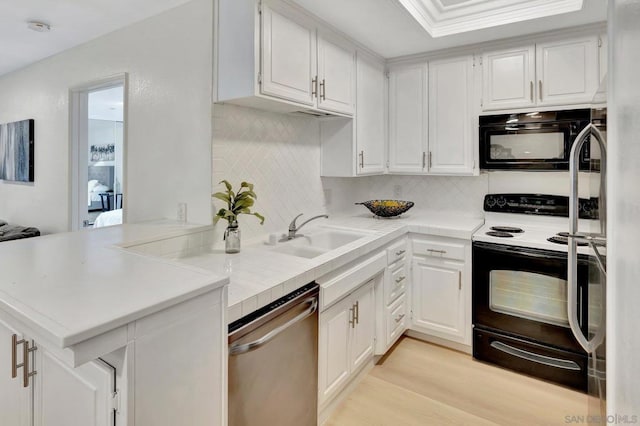 kitchen with dishwasher, white cabinetry, sink, kitchen peninsula, and electric range