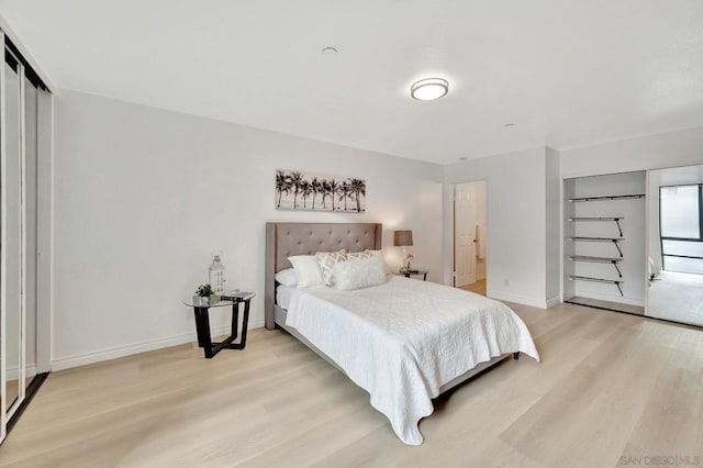 bedroom with light wood-type flooring