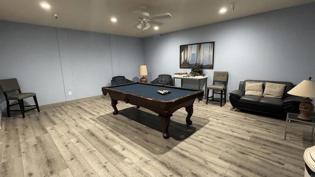 rec room with light hardwood / wood-style floors, ceiling fan, and pool table