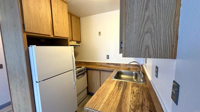 kitchen with sink and white appliances