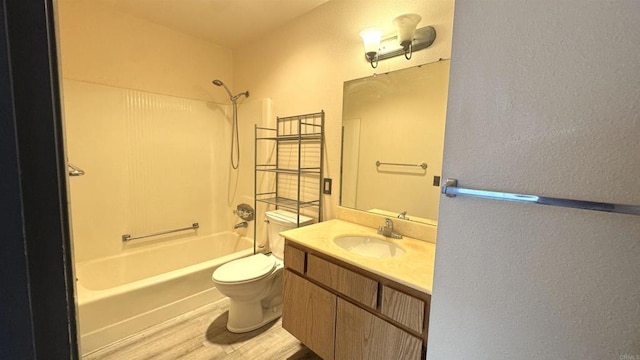 3776 Alabama St Unit 318, San Diego, CA 92104 - full bathroom with wood finished floors, toilet, washtub / shower combination, vanity, and a textured wall
