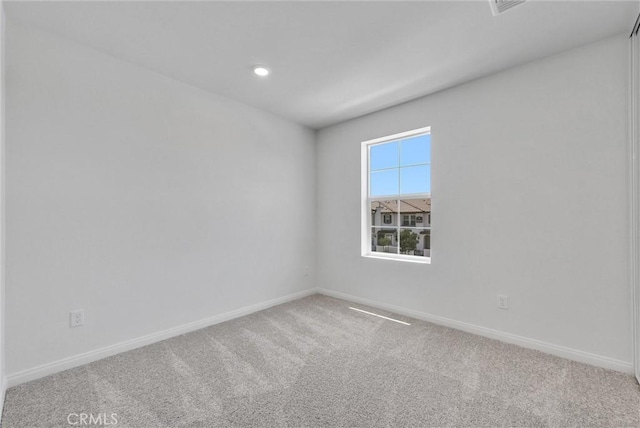 unfurnished room with carpet flooring