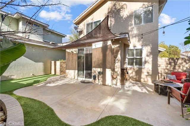 back of house featuring a patio