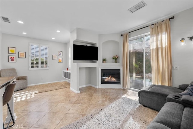 living room with light tile patterned floors