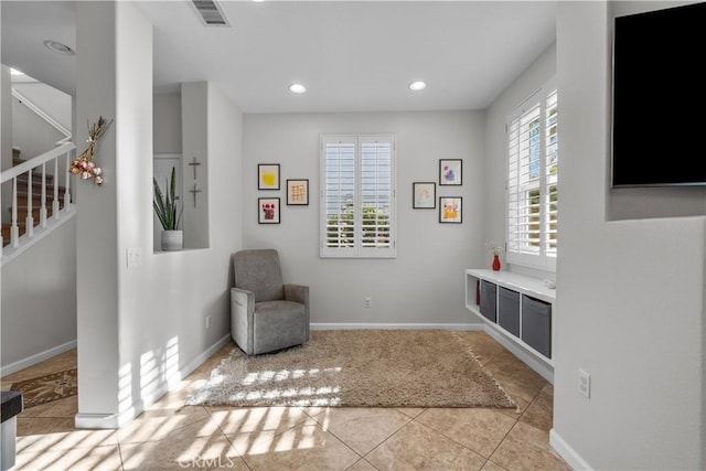 sitting room with light tile patterned floors