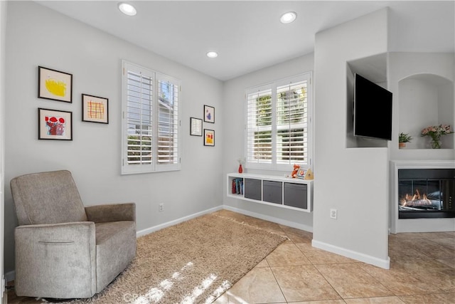 living area with light tile patterned floors