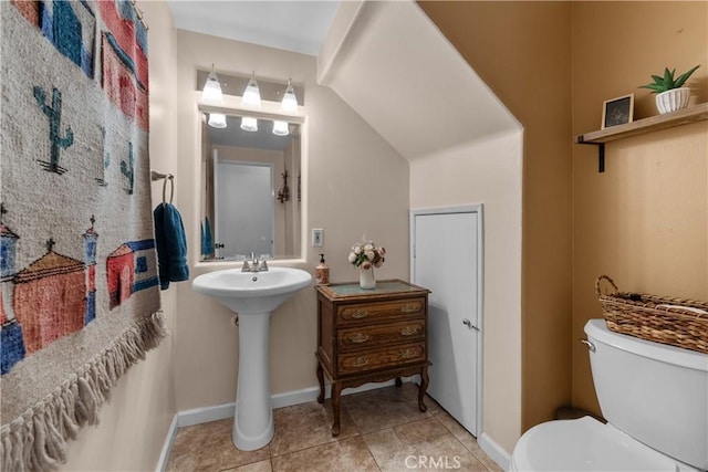 bathroom featuring toilet and tile patterned floors